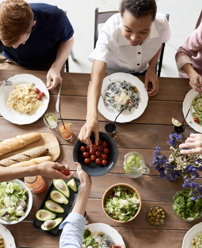 Group of people eating a meal